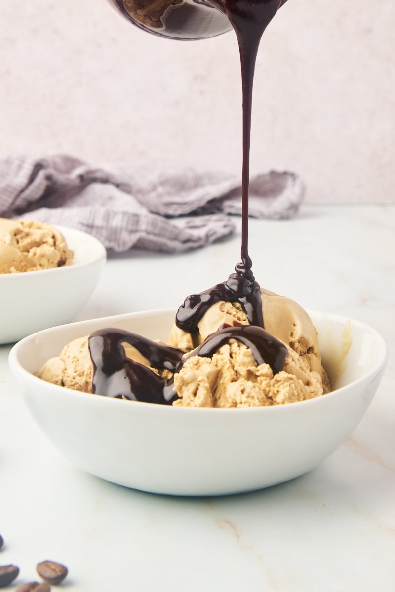 hot fudge sauce drizzling over coffee ice cream