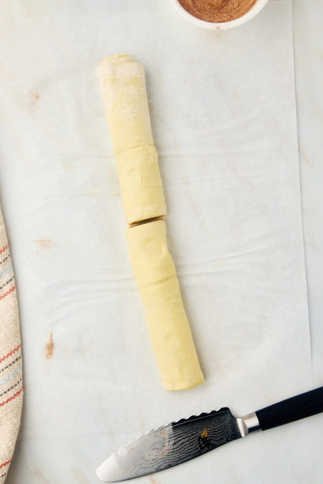 overhead view of cruffin dough log cut in half