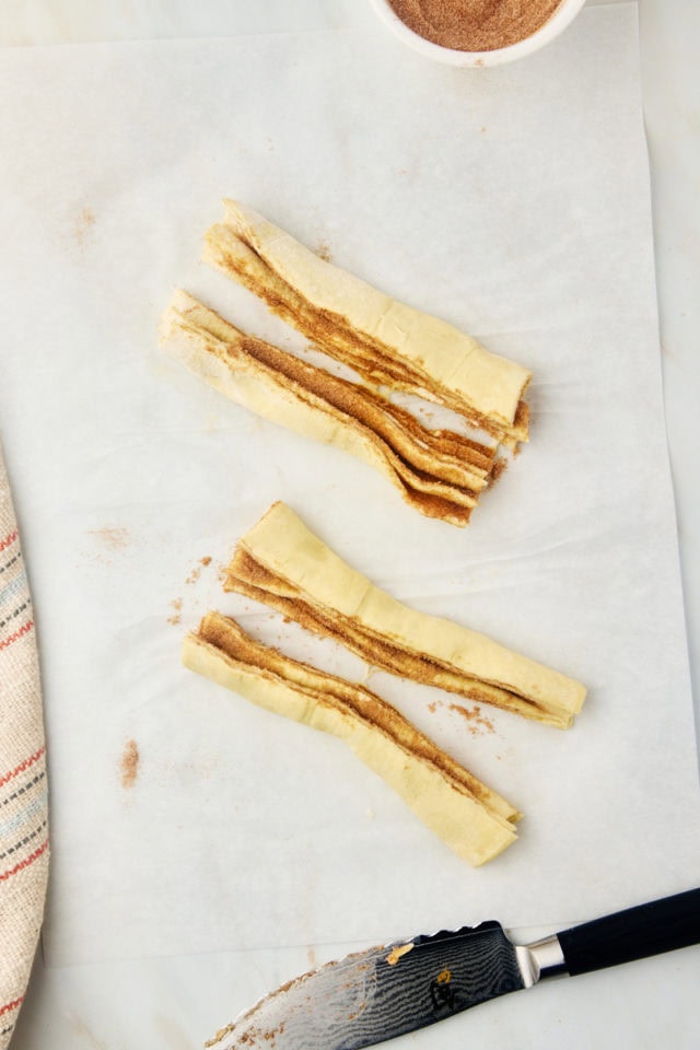 overhead view of cruffin dough cut into four portions