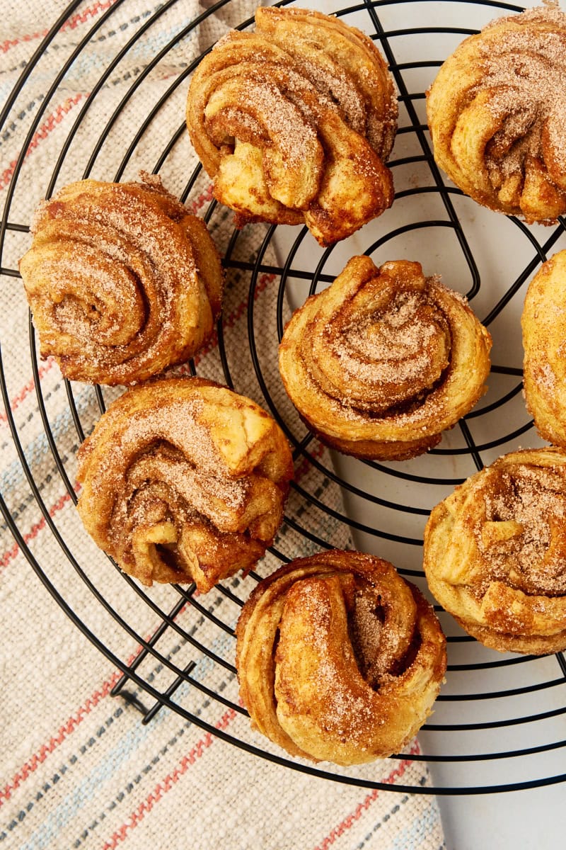 overhead view of cruffins on a wire cooling rack