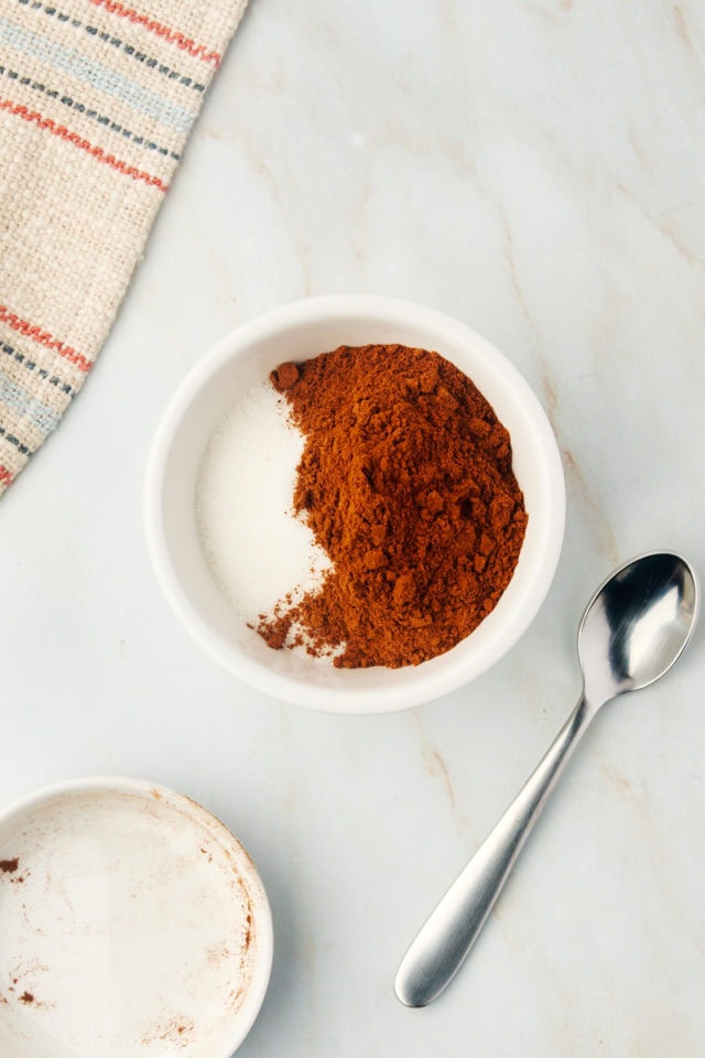 overhead view of cinnamon and sugar in a small white bowl