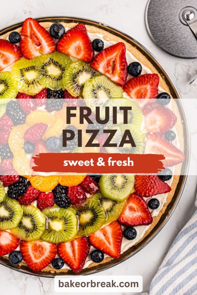 overhead view of fruit pizza on a pizza pan; text overlay "fruit pizza sweet & fresh bakeorbreak.com"