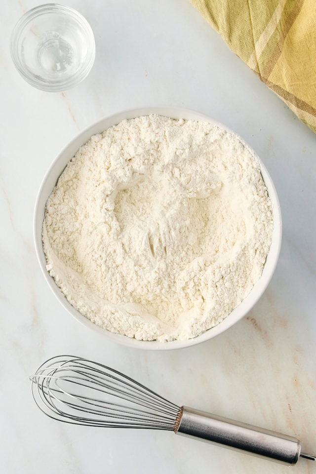 Dry ingredients for limoncello cake in mixing bowl