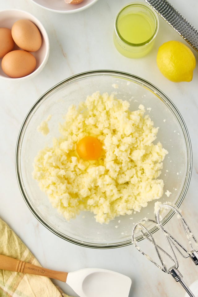 Egg added to creamed butter and sugar in mixing bowl