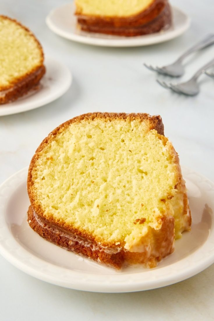 Moist limoncello cake slice on plate