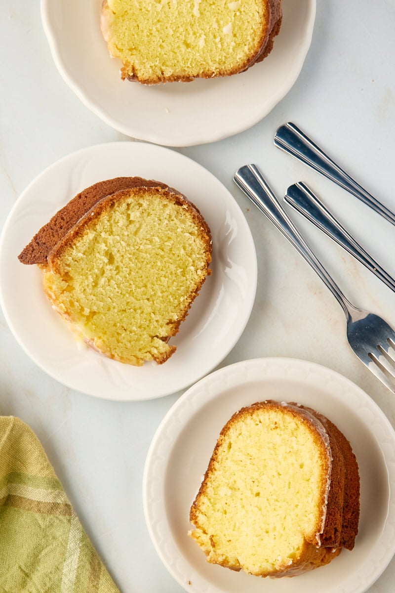 Overhead view of 3 slices of limoncello cake on plates