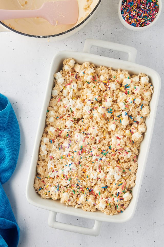 overhead view of rice crispy treats in a white pan