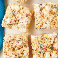 overhead view of rice crispy treats scattered on parchment paper