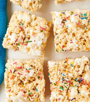 overhead view of rice crispy treats scattered on parchment paper