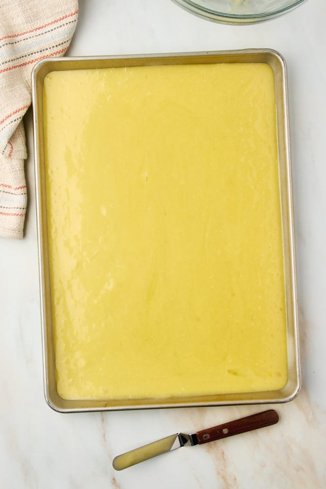 overhead view of white Texas sheet cake spread in a half sheet pan