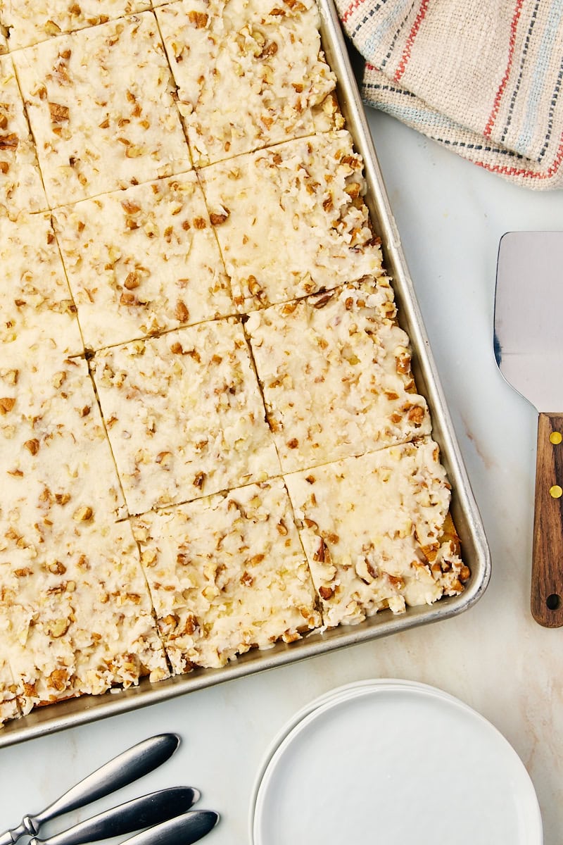 overhead view of sliced white Texas sheet cake in a sheet pan