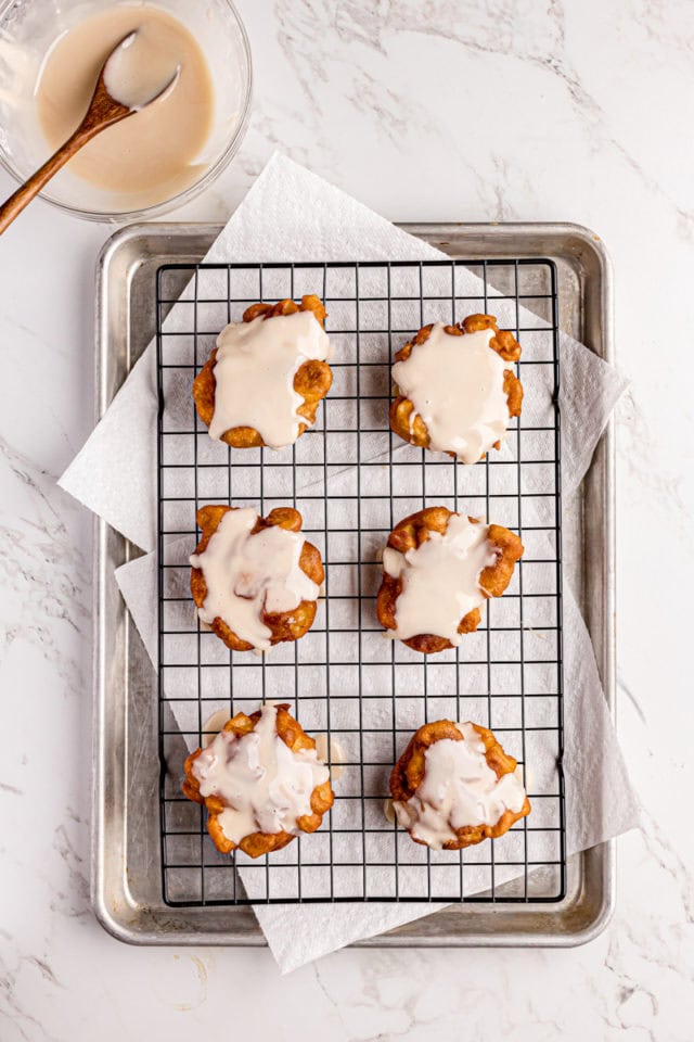 overhead view of freshly glazed apple fritters