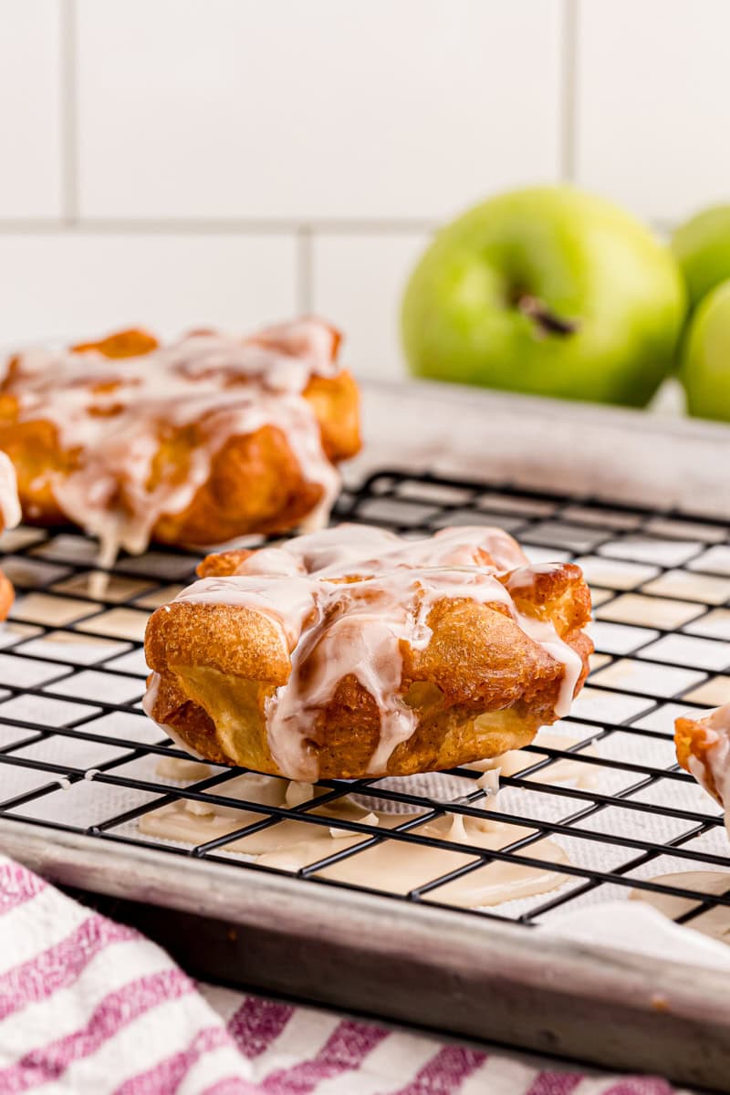 apple fritters on a wire rack