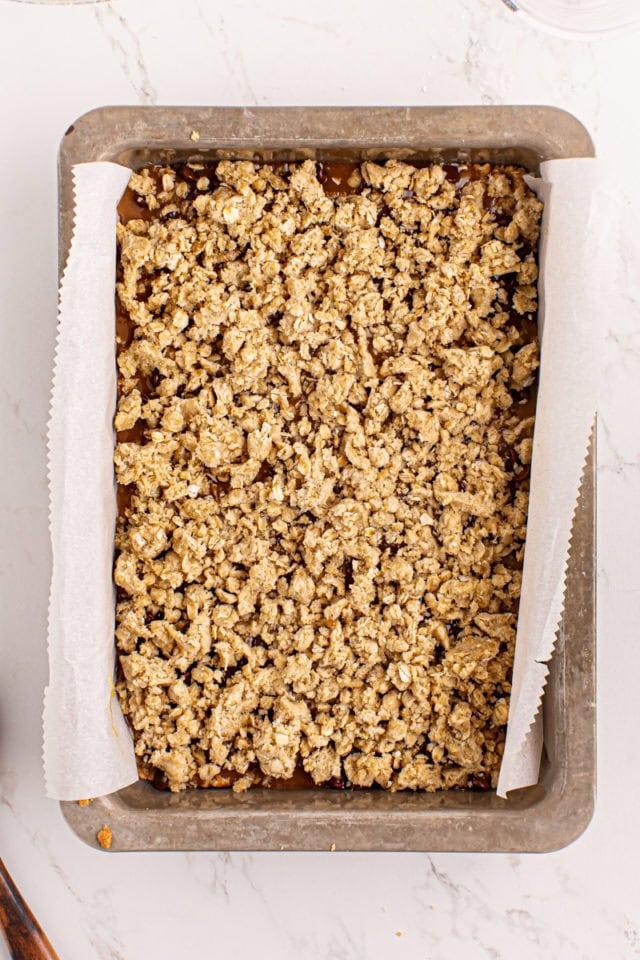 overhead view of assembled caramel oatmeal bars ready to go into the oven