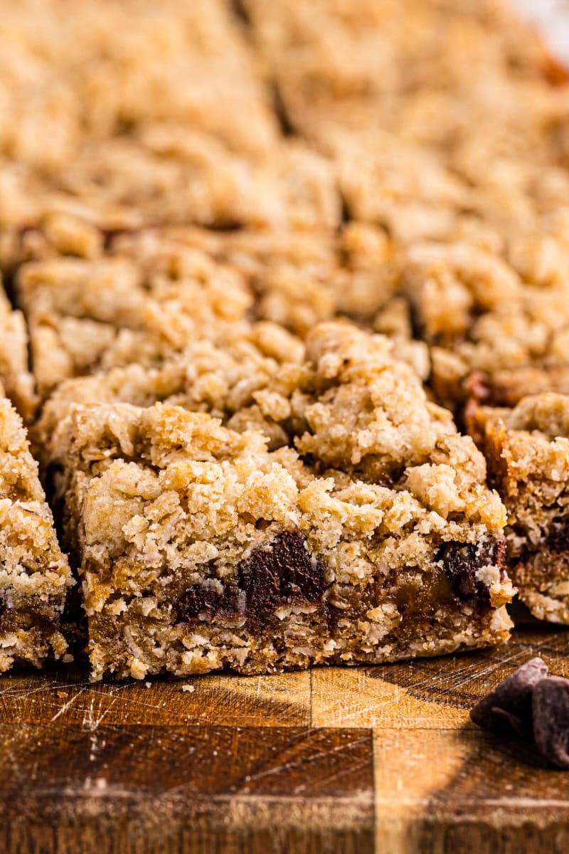 caramel oatmeal bars on a wooden cutting board