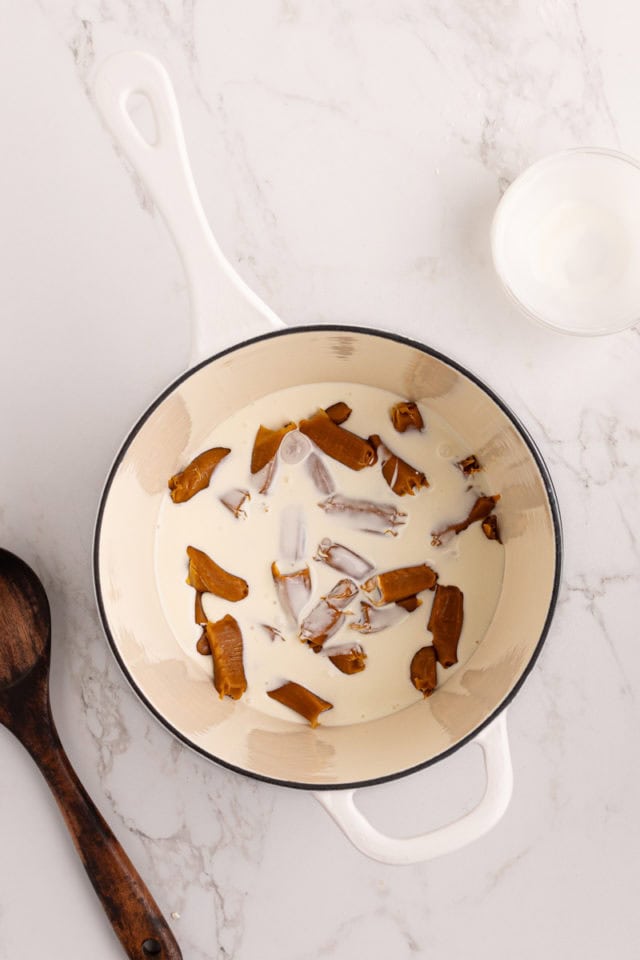 overhead view of soft caramels and cream in a saucepan