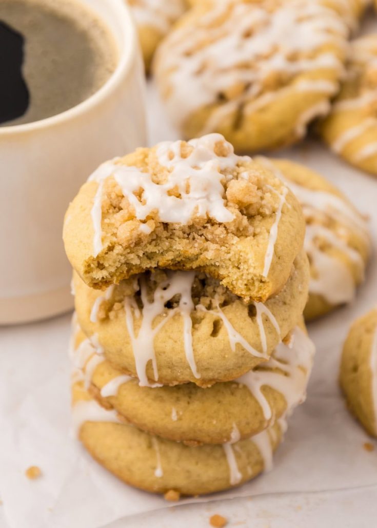 stack of coffee cake cookies with a bite missing from the top cookie