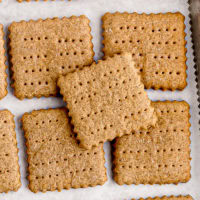 overhead view of homemade graham crackers on a baking sheet