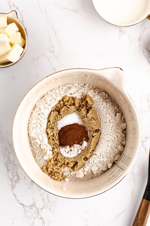 overhead view of dry ingredients for homemade graham crackers in a mixing bowl