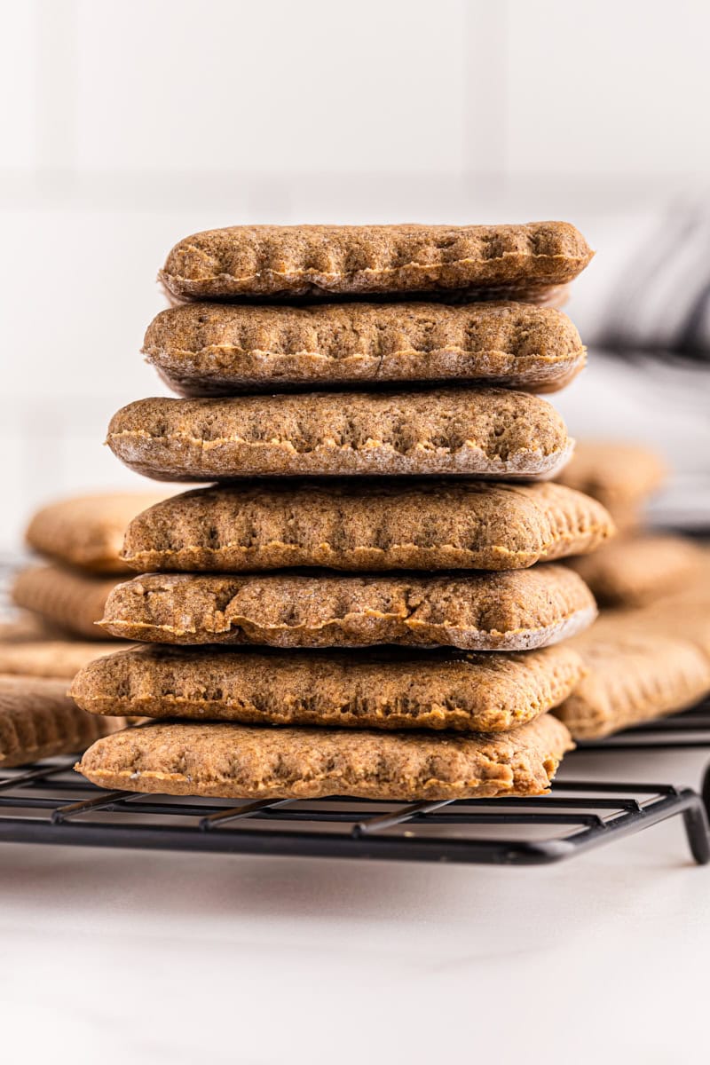 stack of seven homemade graham crackers on a wire rack