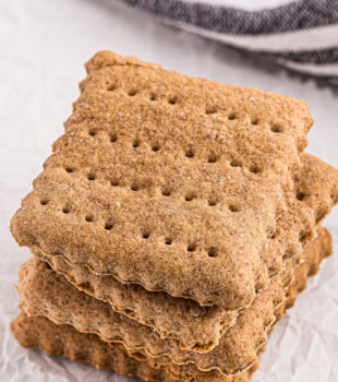 stack of homemade graham crackers on parchment paper