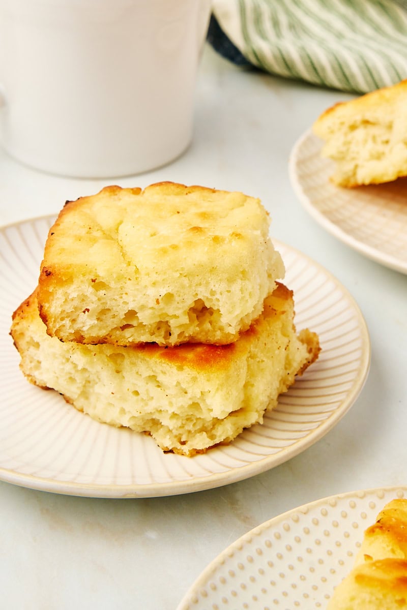 two butter swim biscuits stacked on a plate