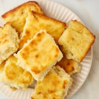 overhead view of butter swim biscuits piled on a plate