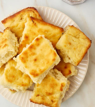 overhead view of butter swim biscuits piled on a plate