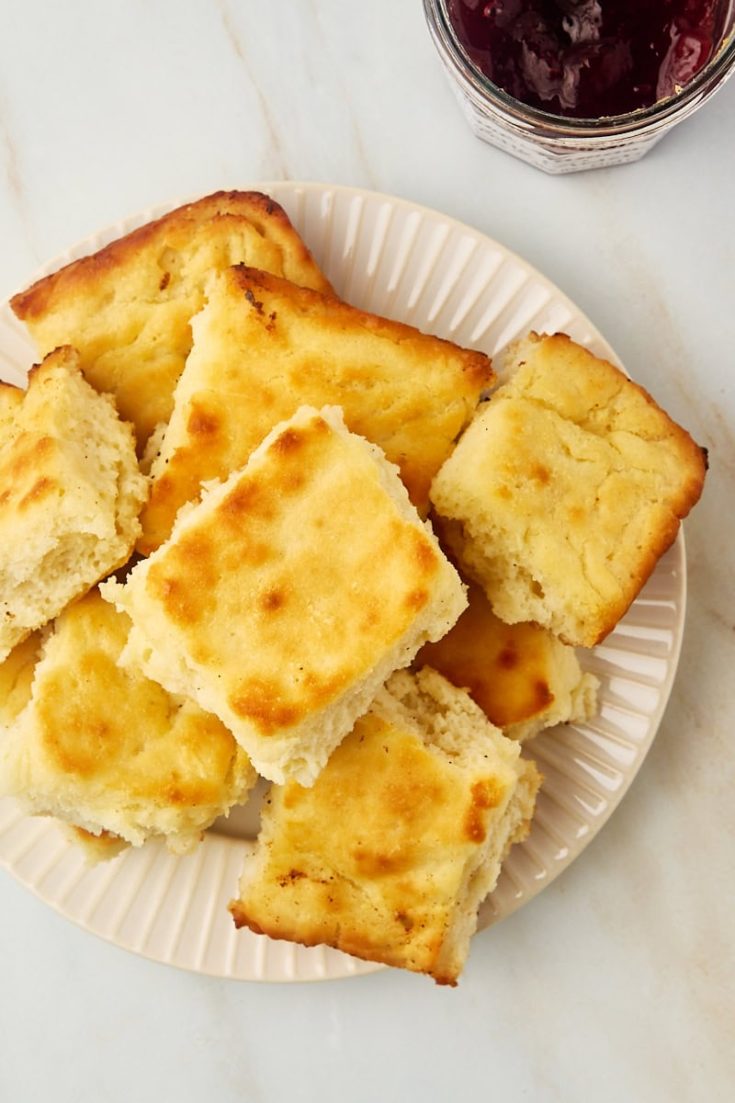 overhead view of butter swim biscuits piled on a plate