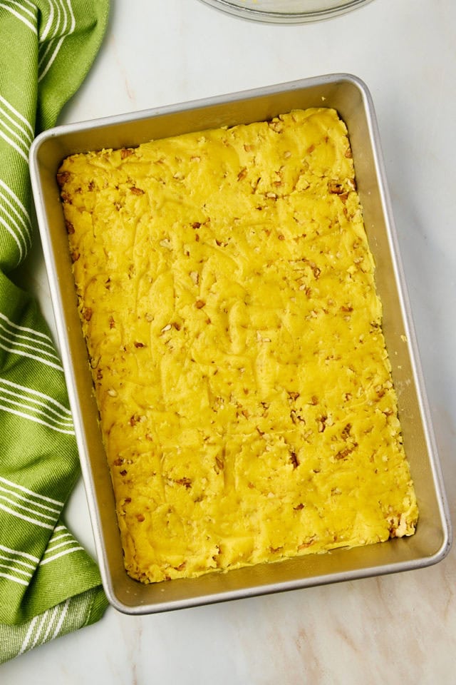 overhead view of chess squares crust mixture spread in a baking pan