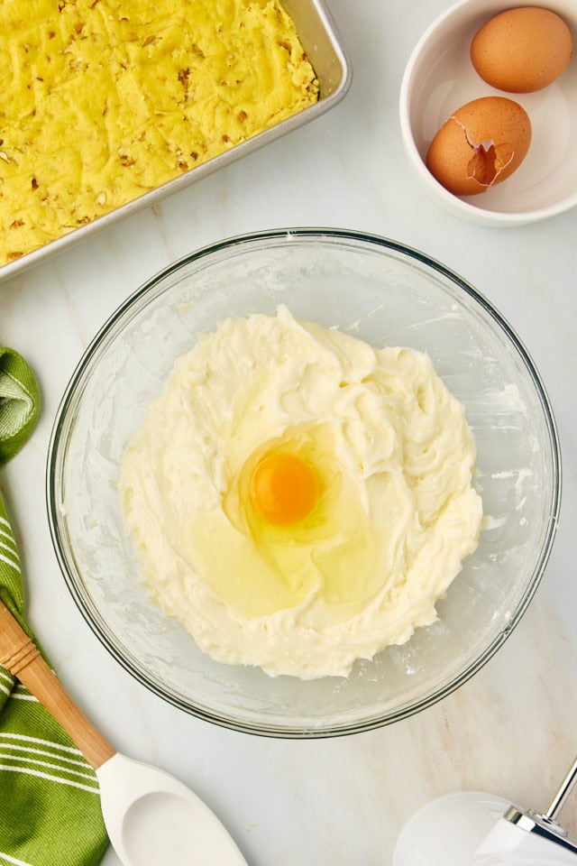 overhead view of egg added to chess squares filling mixture