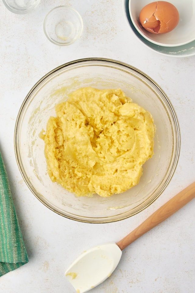 overhead view of crust mixture for gooey butter cake in a glass mixing bowl