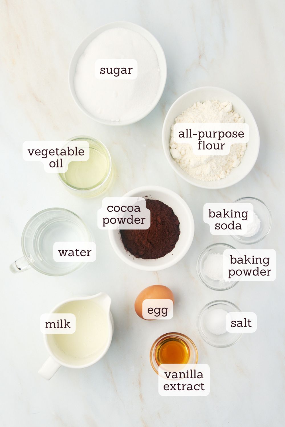 overhead view of labeled ingredients for one-bowl chocolate cake