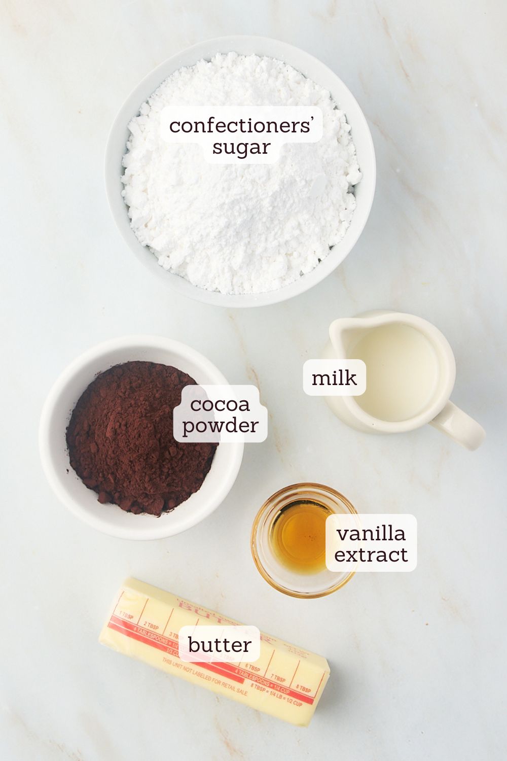 overhead view of labeled ingredients for chocolate buttercream frosting