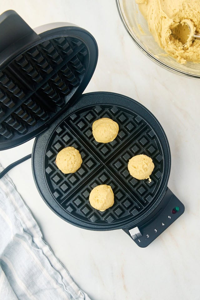 overhead view of waffle cookie dough in a waffle maker