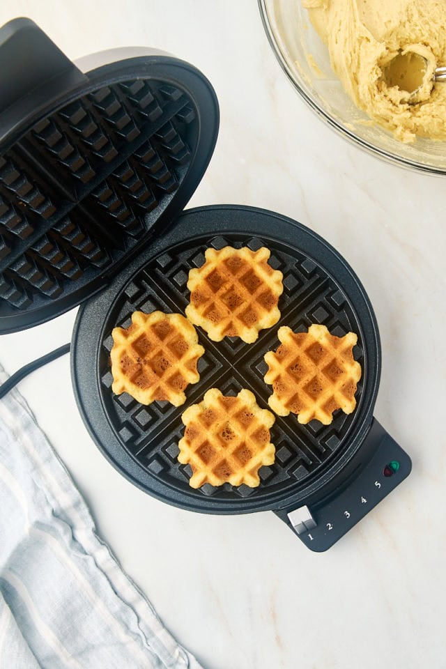 overhead view of freshly made waffle cookies in a waffle maker