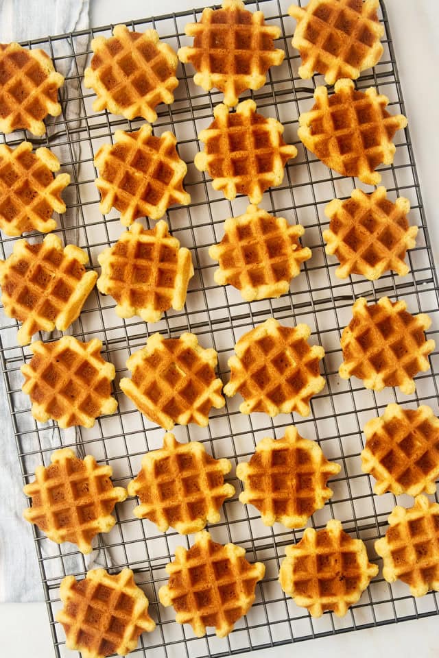 overhead view of waffle cookies on a wire cooling rack