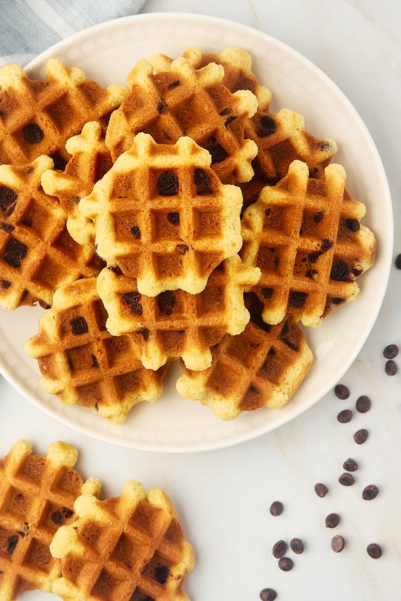 overhead view of chocolate chip waffle cookies on a white plate