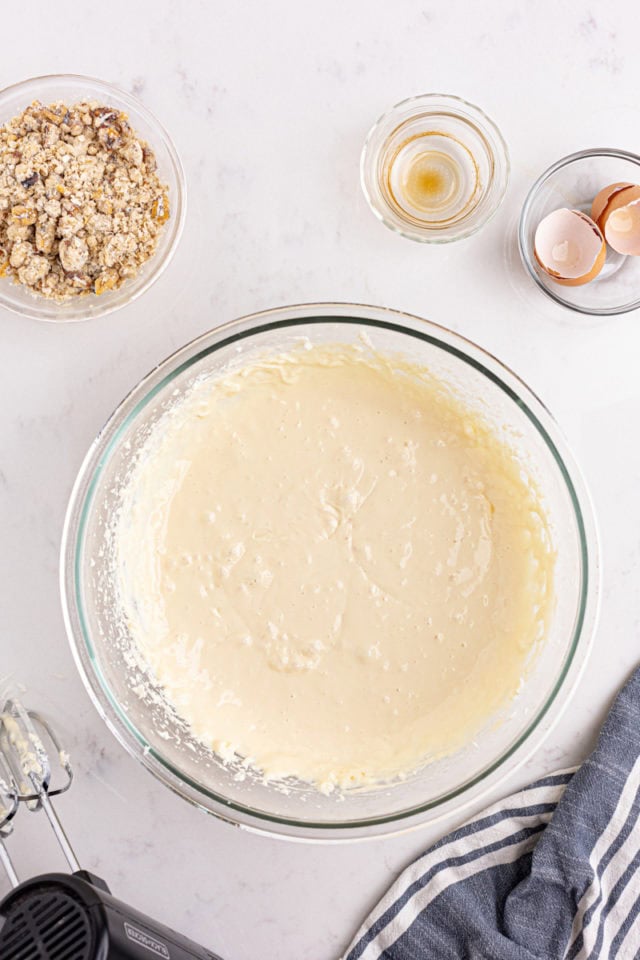 overhead view of mixed cheesecake filling for apple butter cream cheese oat bars