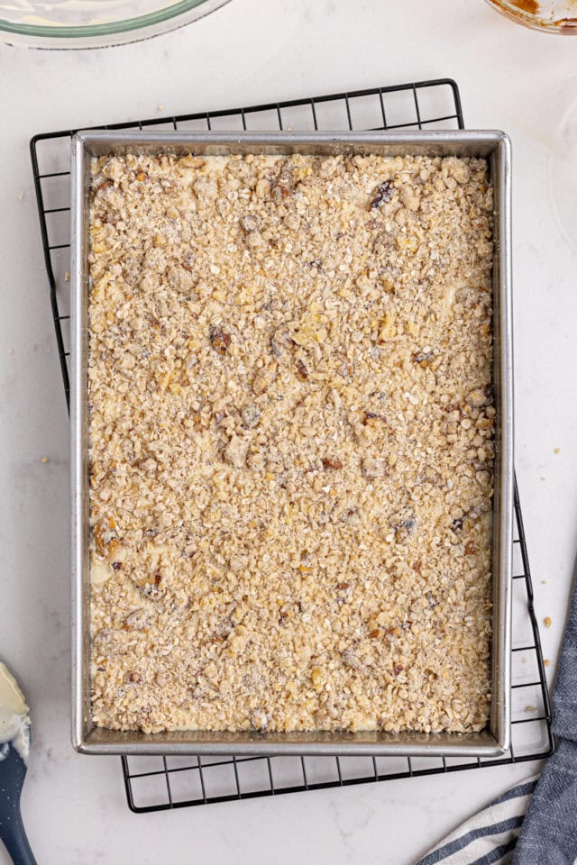 overhead view of assembled apple butter cream cheese oat bars ready to go into the oven