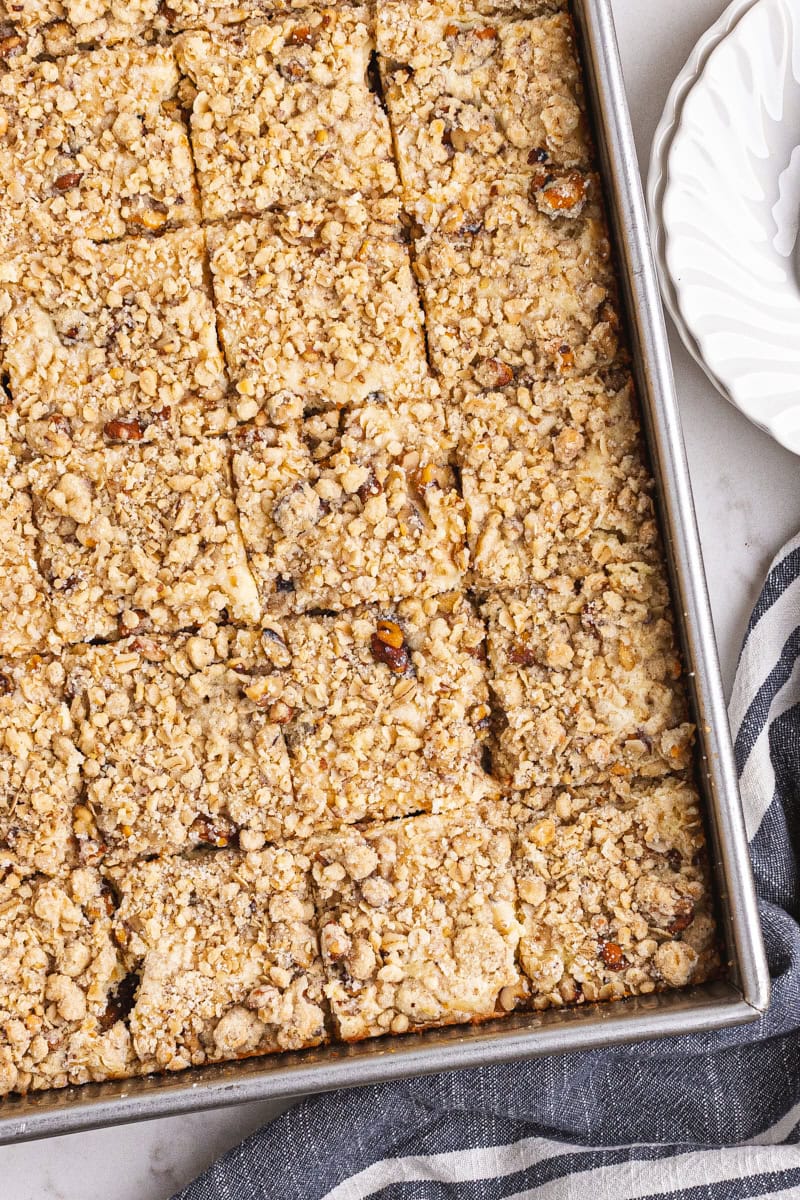 overhead view of apple butter cream cheese oat bars cut into bars