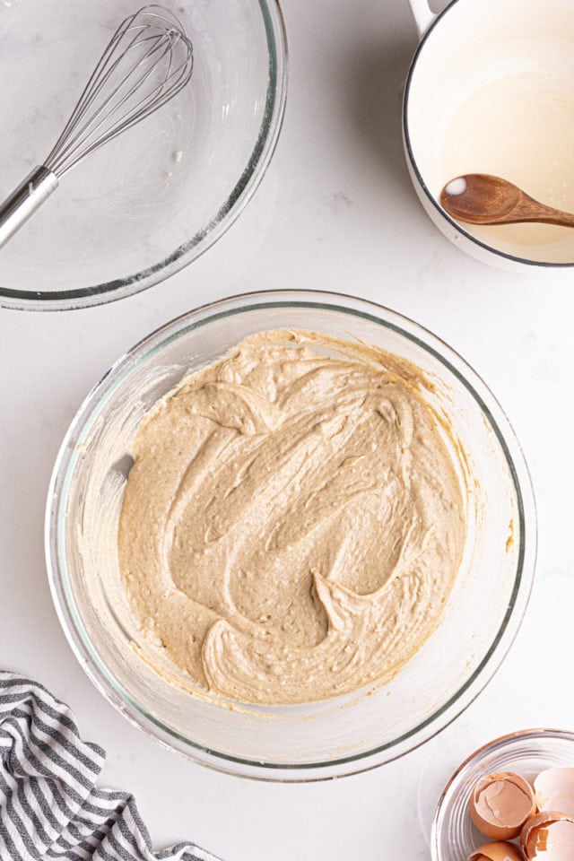 overhead view of chai spice cupcake batter in a glass mixing bowl