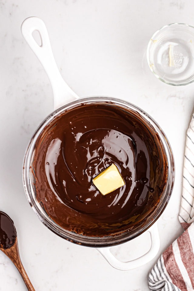 overhead view of butter added to melted chocolate