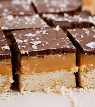 millionaire shortbread bars on parchment paper