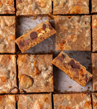 overhead view of sliced peanut butter candy bar squares with two turned on their sides