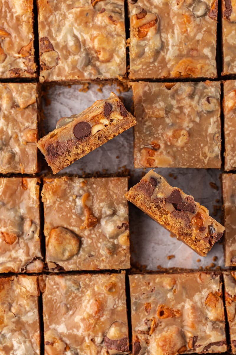 overhead view of sliced peanut butter candy bar squares with two turned on their sides