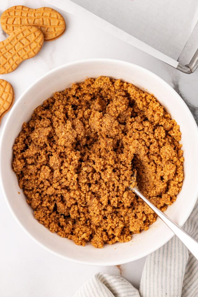 overhead view of Nutter Butter cookie crust mixture in a white bowl