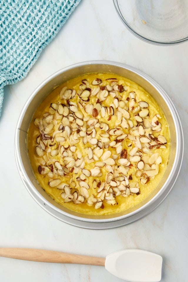 overhead view of almond torte in a springform pan ready to go into the oven