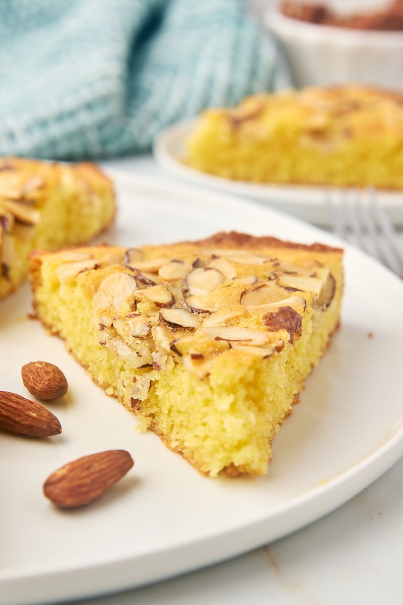 a slice of almond torte on a white plate