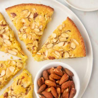 overhead view of slices of almond torte on a large white plate